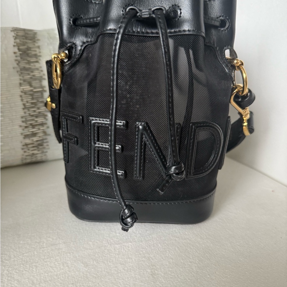 Fendi mesh mini mon tresor bucket bag. Black DrawstringBag with Gold Hardware